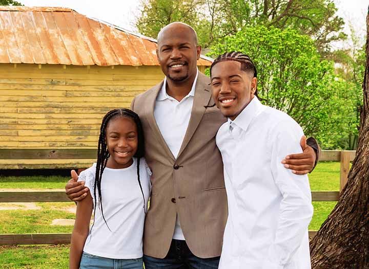 Loving family portrait outdoors at the park