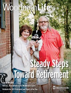 Lovely senior couple holding their dog