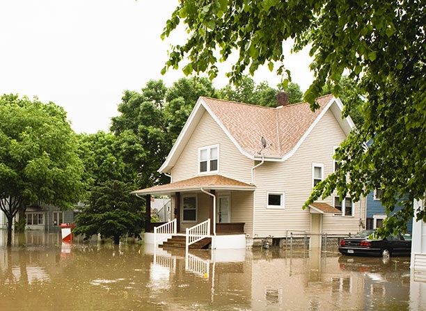 Houses partially underwater from flooding.