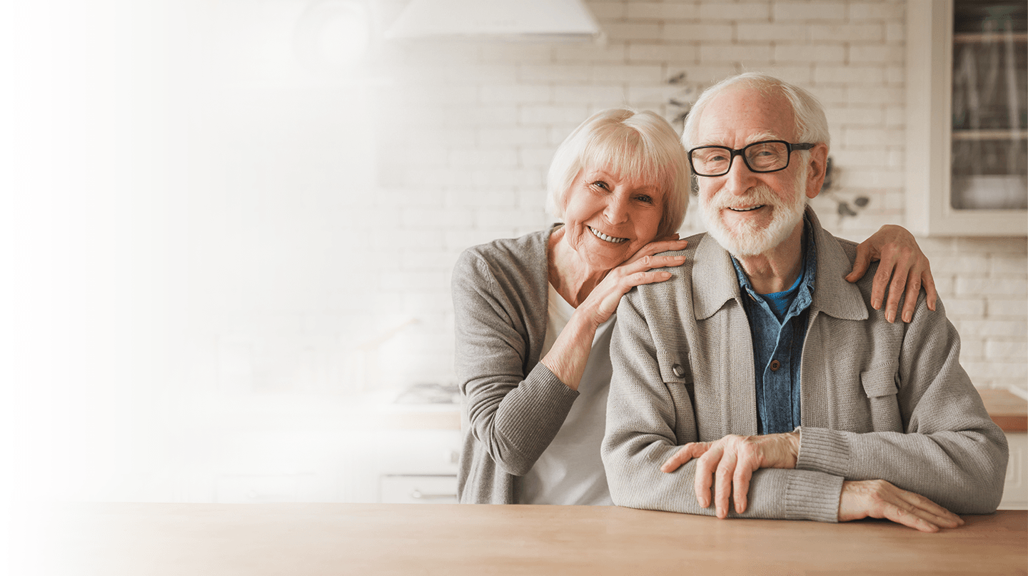 A smiling elderly couple